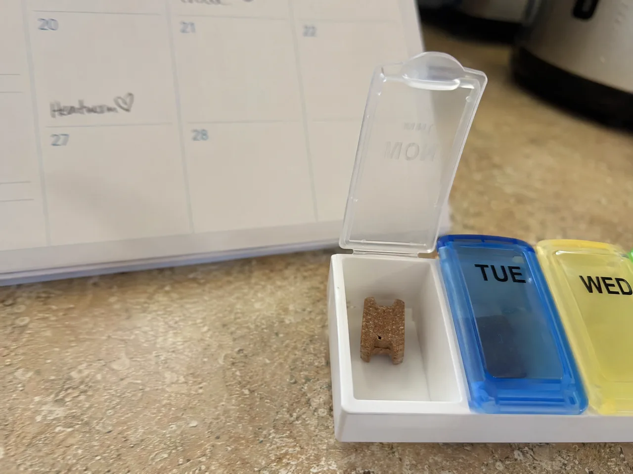 A dog receiving its monthly heartworm prevention medication